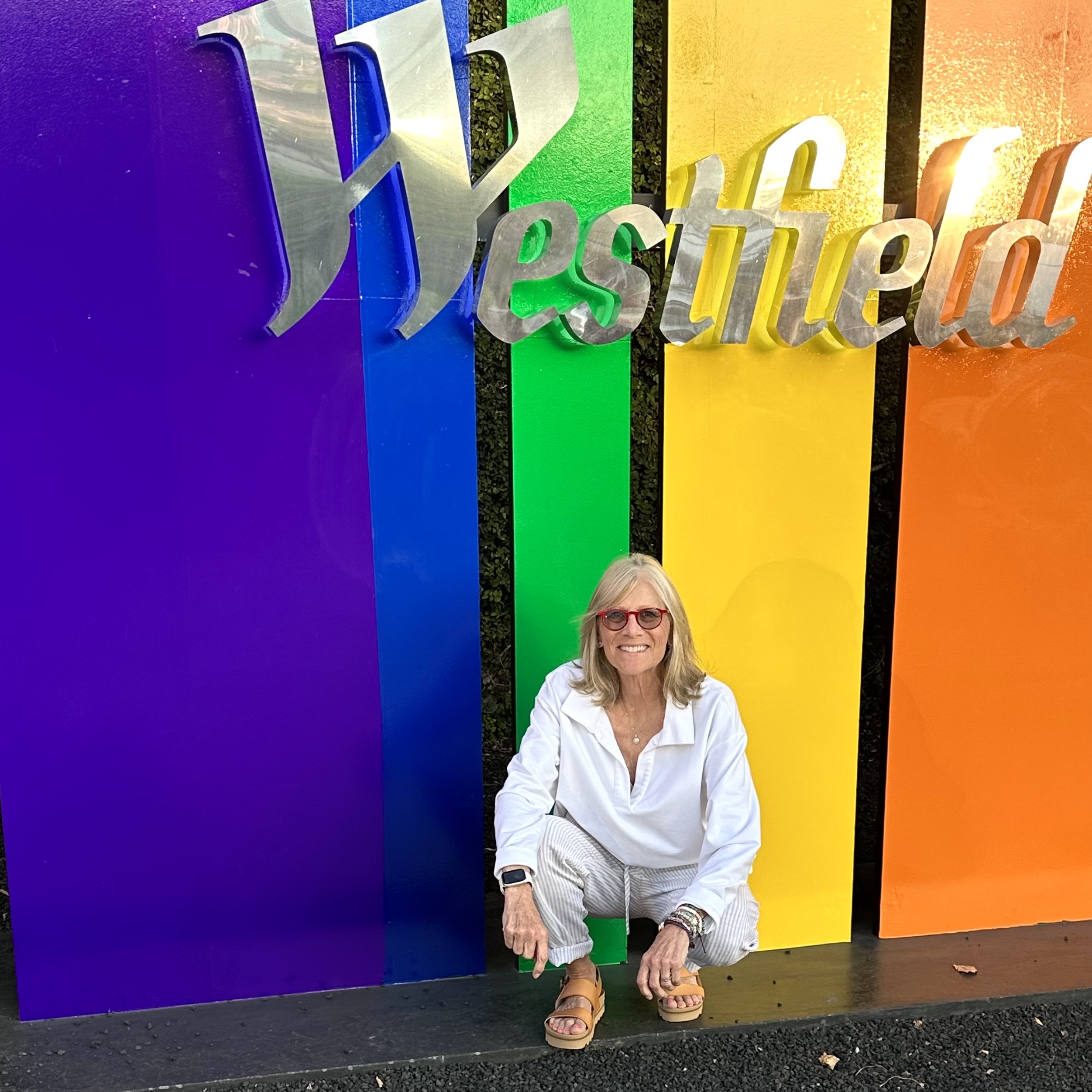 Casey poses with a Pride sign