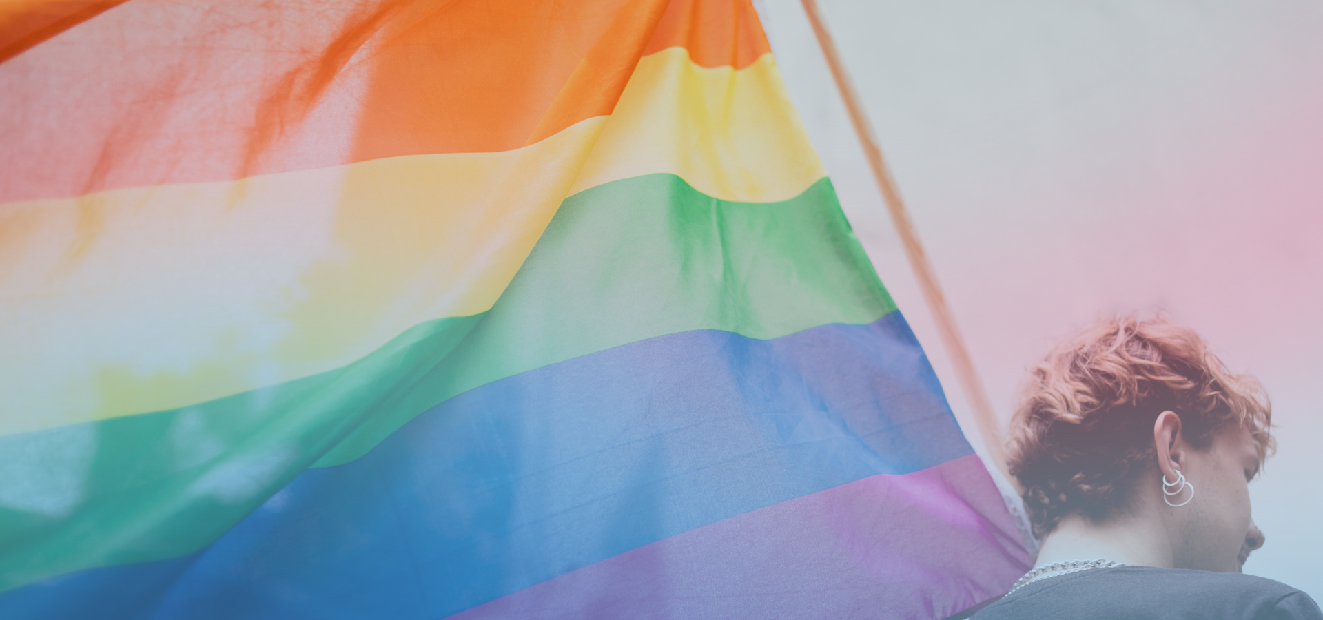 Person holding a Pride Flag